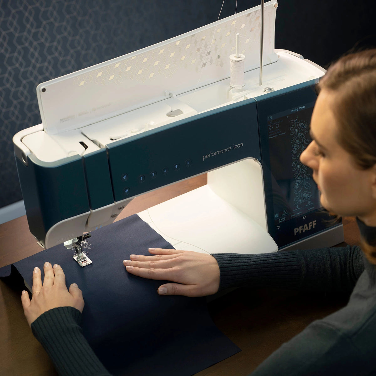 Quilter using the large PFAFF performance icon sewing area
