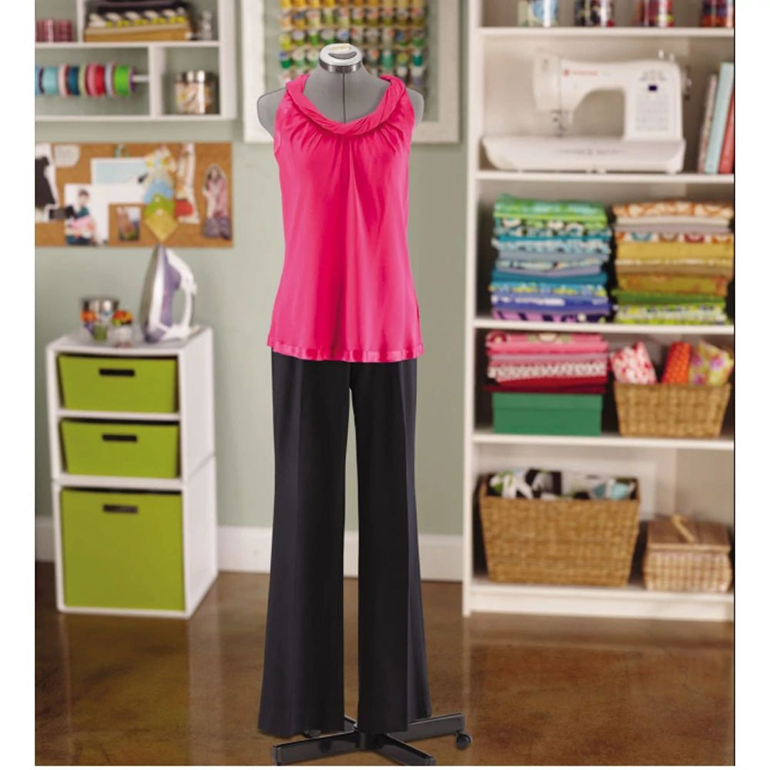 Pink top and black trousers displayed on the grey SINGER 151 adjustable dress form