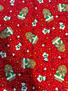Motivo navideño vintage con leones y osos polares sobre fondo rojo, 100 % algodón ligero. Precio por yarda.