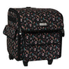 Estuche plegable con ruedas para máquina de coser, negro con motivos florales