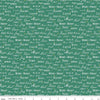 Texto navideño sobre fondo verde festivo. 100 % algodón. Precio por yarda.