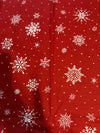 Diseño vintage con copos de nieve y lunares sobre fondo rojo, 100 % algodón ligero. Precio por yarda.