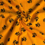 Tissu polaire jaune à motifs de pattes – Vendu au mètre