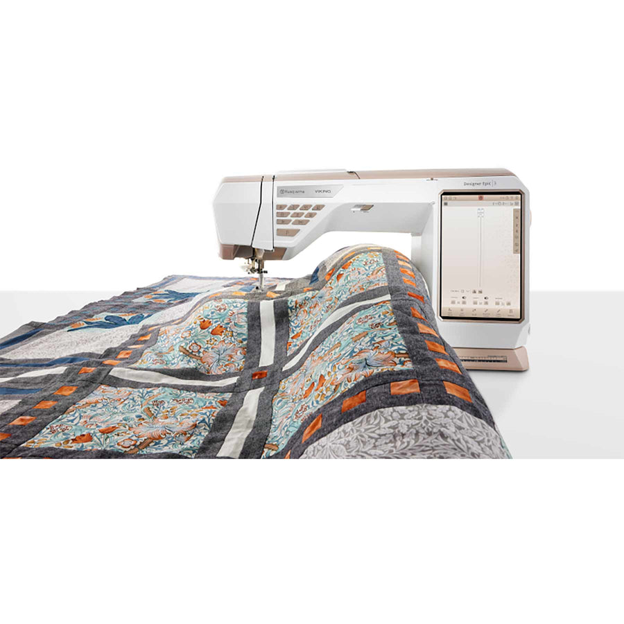 Large quilt passing through the 310mm sewing space of the Designer Epic 3