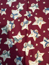 Estrellas vintage con muñecos de nieve sobre fondo rojo. 100 % algodón ligero. Precio por yarda.