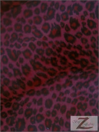 Tela de felpa de pelo corto con estampado de guepardo en rojo y negro / Se vende por metros