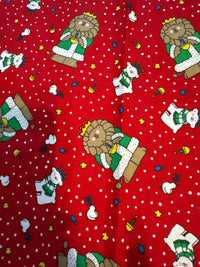 Motivo navideño vintage con leones y osos polares sobre fondo rojo, 100 % algodón ligero. Precio por yarda.