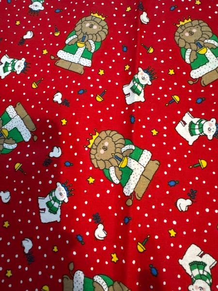 Motivo navideño vintage con leones y osos polares sobre fondo rojo, 100 % algodón ligero. Precio por yarda.