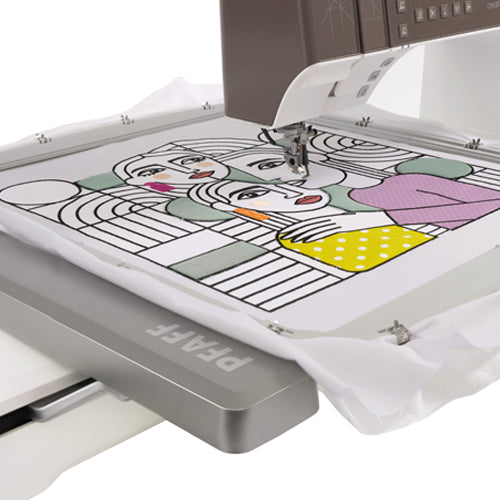 Embroidery machine with a colorful design on a white fabric
