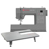 Lote compuesto por la máquina de coser computarizada SINGER® Heavy Duty 6600C y una mesa de extensión