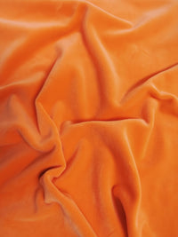 Tela elástica de mochi naranja tipo minky / Tela lisa y suave, vendida por metros