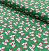 Ositos de peluche navideños y copos de nieve sobre tela verde 100 % algodón