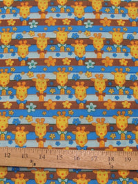 Tela de poliéster y algodón con estampado de jirafas azules