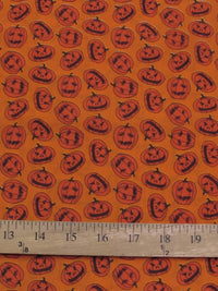 Tissu en polycoton orange « Citrouilles d'Halloween »