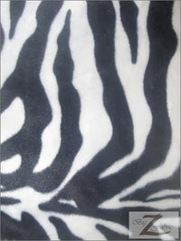 Tejido de felpa de pelo corto con estampado de cebra, rayas anchas, en blanco y negro / Se vende por metros