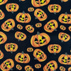 Tela de algodón 100 % con calabazas alegres de Halloween sobre fondo negro