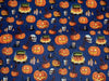 Halloween Spooky Smiling Pumpkin and Skulls on Blue 100% Cotton Fabric